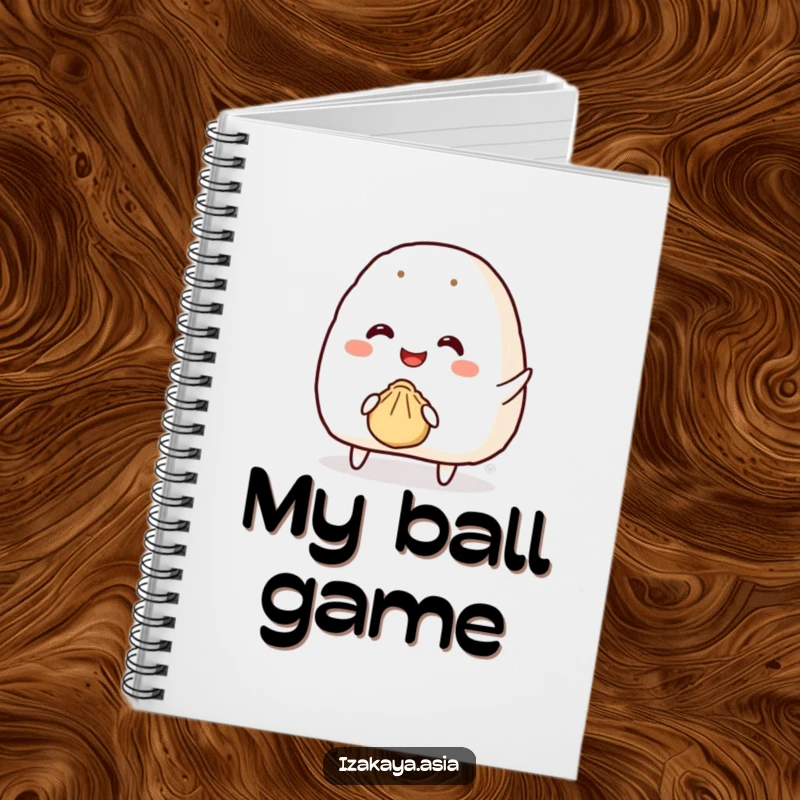 Funny onigiri notebook with a smiling character attempting to throw a tiny bouncy dumpling, great for notes.
